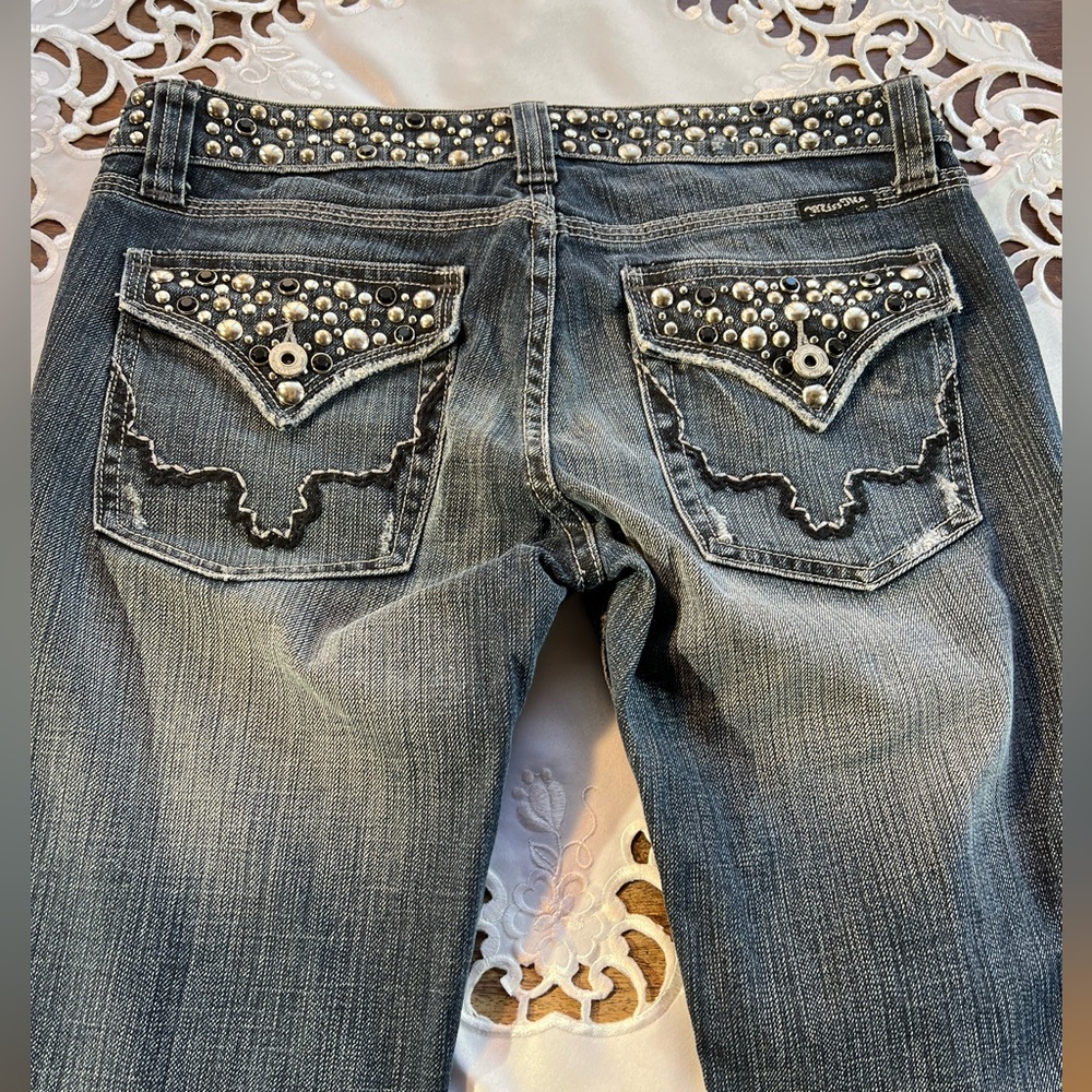 Miss Me distressed jeans with beautiful stone design on belt and packets…